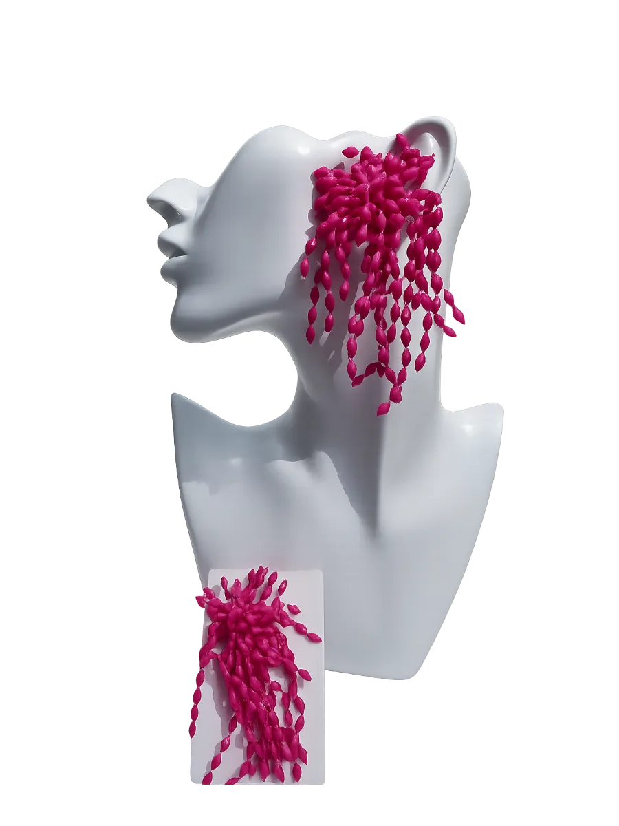 Etsy A fuchsia resin, firework-style long drop earrings.